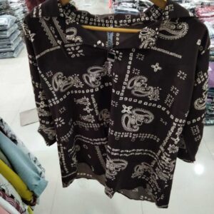 Women's dark brown blouse with cream paisley and geometric print featuring a V-neck notched collar.