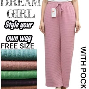 Woman wearing mustard tan wide-leg lounge pants with a quilted square texture and drawstring waist.