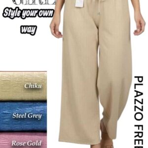 Woman wearing beige wide-leg palazzo pants with a grid-like texture and drawstring waist.
