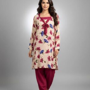 Woman wearing a cream-colored long-sleeve kurti with pink and blue floral prints and matching magenta trousers.