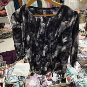 Women's charcoal and black abstract smoke print tunic with a smocked bodice and long sleeves.